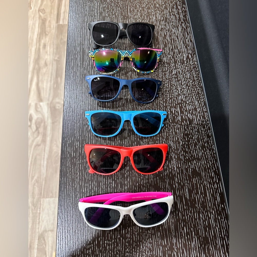 Lot of 6 new plastic sunglasses in various colors.